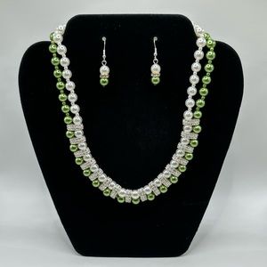 Green and white pearl necklace and earrings set with diamond style stones
